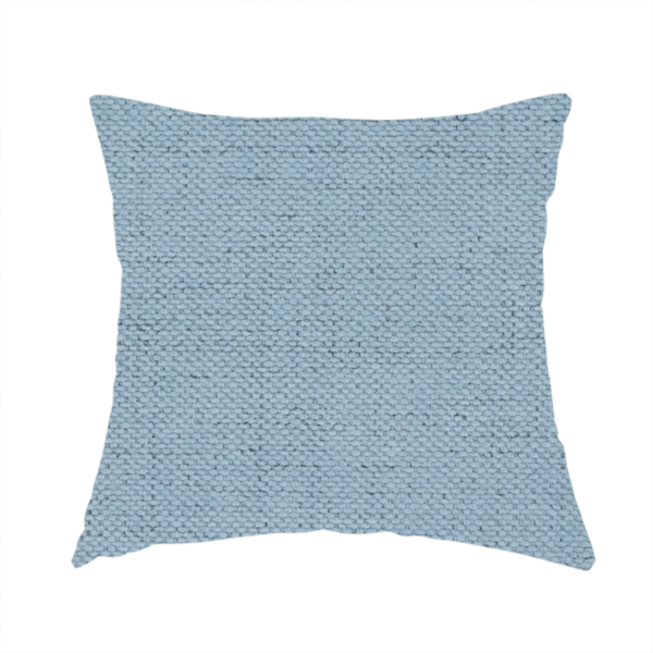 The fabric used to create these handmade cushions is a textured woven fabric in a soft, light powder blue or serene sky blue shade.