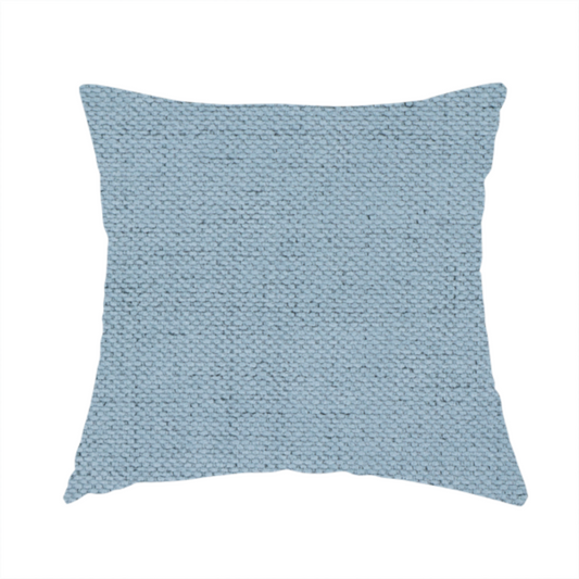 The fabric used to create these handmade cushions is a textured woven fabric in a soft, light powder blue or serene sky blue shade.