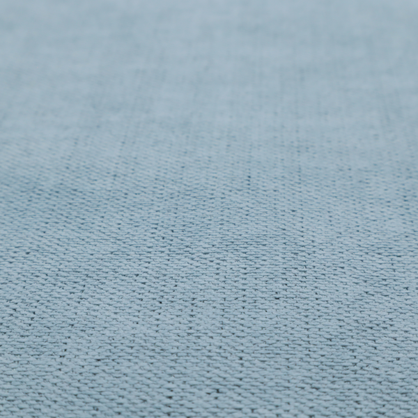 A textured woven fabric in a soft, light powder blue or serene sky blue shade.