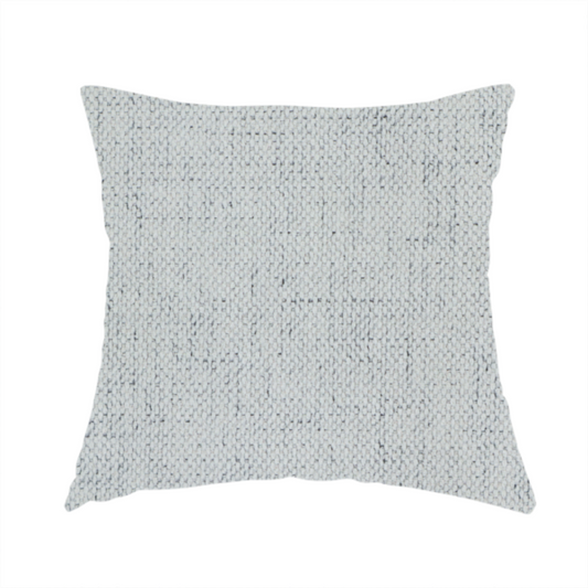The fabric used to create this handmade cushion is a textured woven fabric in a cool, light grey or soft slate shade.
