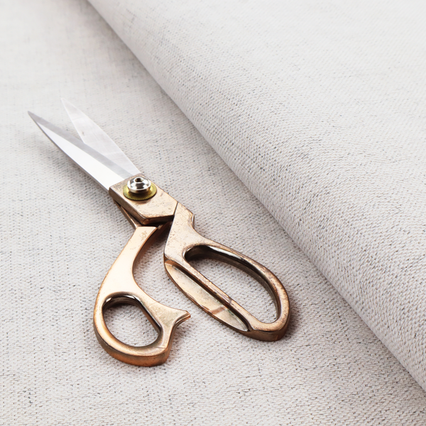 a textured woven fabric in a very light grey or soft ash shade.