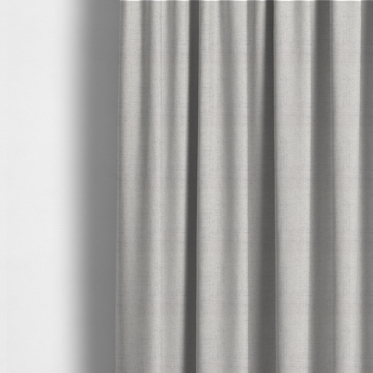 The fabric used to create these made-to-measure curtains is a textured woven fabric in a very light grey or soft ash shade.