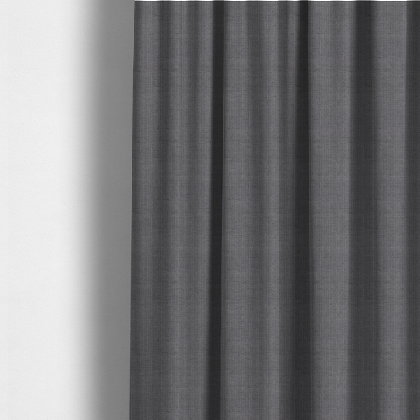 The fabric used to create these made-to-measure curtains is a textured woven fabric in a medium charcoal or slate grey shade.