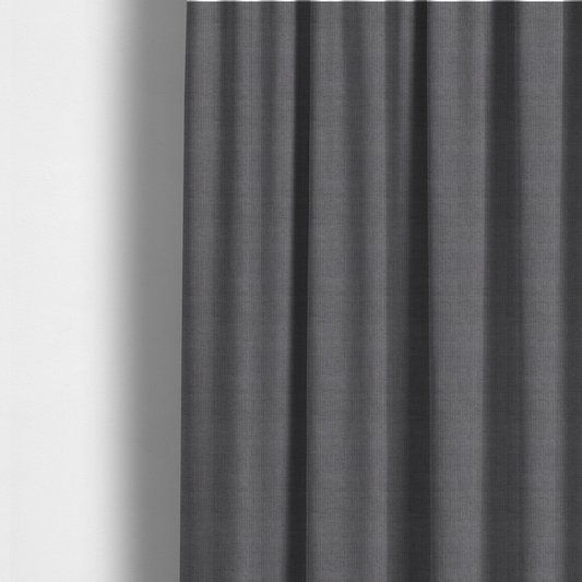 The fabric used to create these made-to-measure curtains is a textured woven fabric in a medium charcoal or slate grey shade.