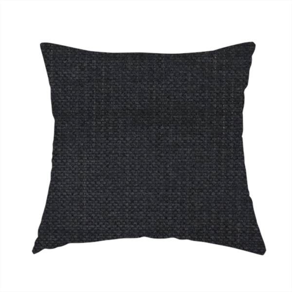 The fabric used to create this handmade cushion is a textured woven fabric in a near-black or extremely dark charcoal shade.