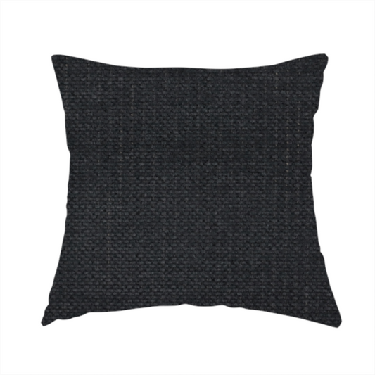 The fabric used to create this handmade cushion is a textured woven fabric in a near-black or extremely dark charcoal shade.