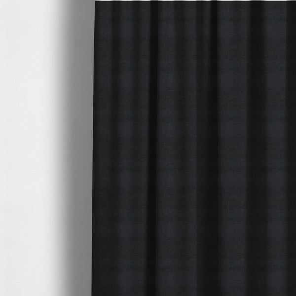 The fabric used to create these made-to-measure curtains is a textured woven fabric in a near-black or extremely dark charcoal shade.