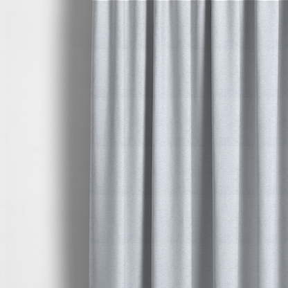 The fabric used to create this made-to-measure curtains is a textured silver woven fabric with a subtle metallic sheen.