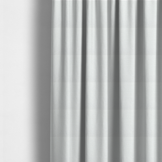 The fabric used to create these made-to-measure curtains is a white woven upholstery fabric with a subtle, textured grain.