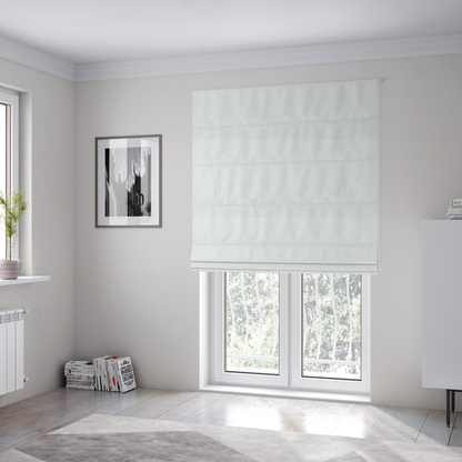 The fabric used to create these Roman blinds is a white woven upholstery fabric with a subtle, textured grain.