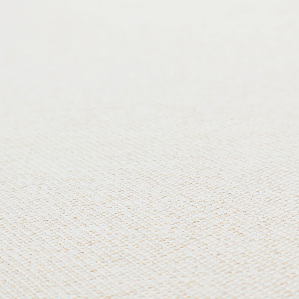 A cream or ivory woven upholstery fabric with a fine, pebble-like texture.