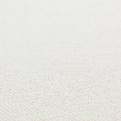 A cream or ivory woven upholstery fabric with a fine, pebble-like texture.