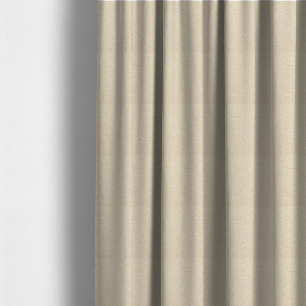 The fabric used to create these made-to-measure curtains is a light beige woven upholstery fabric with a dense, sandy texture.