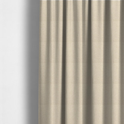 The fabric used to create these made-to-measure curtains is a light beige woven upholstery fabric with a dense, sandy texture.