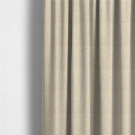 The fabric used to create these made-to-measure curtains is a light beige woven upholstery fabric with a dense, sandy texture.