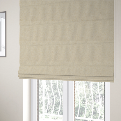 The fabric used to create these Roman blinds is a light beige woven upholstery fabric with a dense, sandy texture.