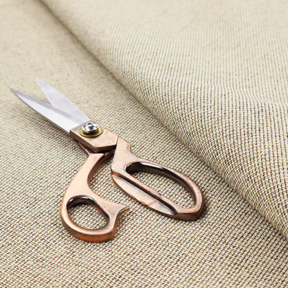 A multi-tonal, tan and olive woven upholstery fabric with a diagonal texture.