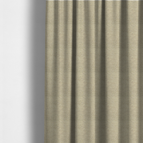 The fabric used to create these made-to-measure curtains is a multi-tonal, tan and olive woven upholstery fabric with a diagonal texture.