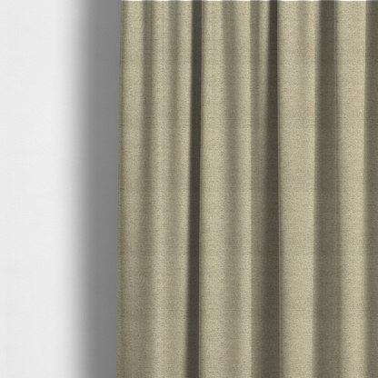 The fabric used to create these made-to-measure curtains is a multi-tonal, tan and olive woven upholstery fabric with a diagonal texture.