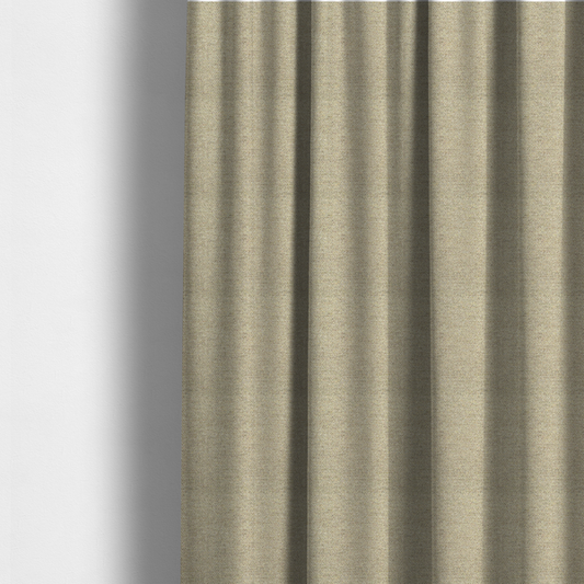 The fabric used to create these made-to-measure curtains is a multi-tonal, tan and olive woven upholstery fabric with a diagonal texture.