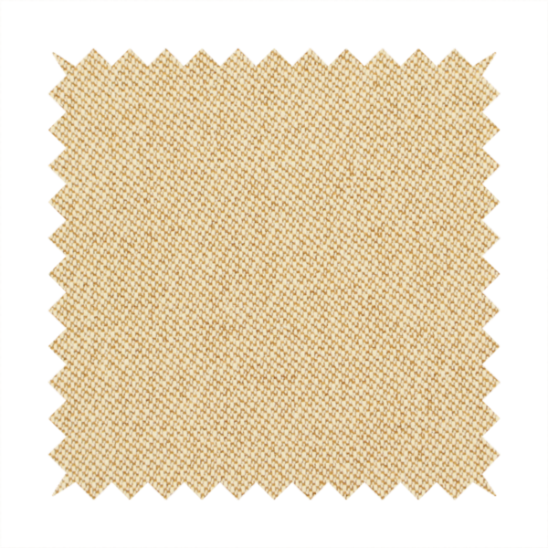 A sandy beige textile featuring a tight diagonal twill weave. The fabric is composed of interlaced cream and light tan threads, creating a fine, granular texture with a matte finish.