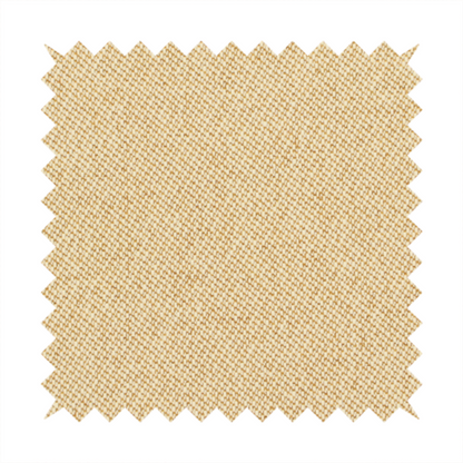 A sandy beige textile featuring a tight diagonal twill weave. The fabric is composed of interlaced cream and light tan threads, creating a fine, granular texture with a matte finish.