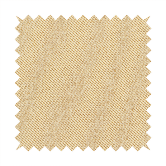 A sandy beige textile featuring a tight diagonal twill weave. The fabric is composed of interlaced cream and light tan threads, creating a fine, granular texture with a matte finish.