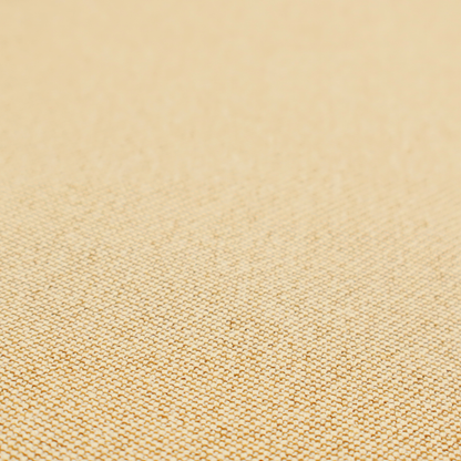 A sandy beige textile featuring a tight diagonal twill weave. The fabric is composed of interlaced cream and light tan threads, creating a fine, granular texture with a matte finish.