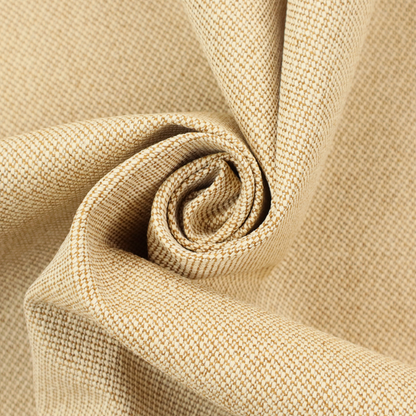 A sandy beige textile featuring a tight diagonal twill weave. The fabric is composed of interlaced cream and light tan threads, creating a fine, granular texture with a matte finish.
