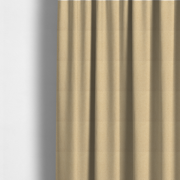 The fabric used to create these made-to-measure curtains is a sandy beige textile featuring a tight diagonal twill weave. The fabric is composed of interlaced cream and light tan threads, creating a fine, granular texture with a matte finish.