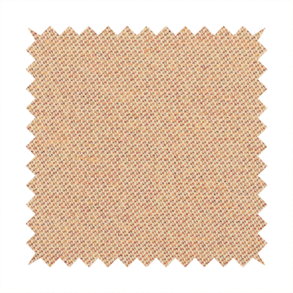 A warm terracotta and peach textile featuring a dense diagonal twill weave. The fabric is a multi-tonal blend of soft orange, muted red, and cream threads, creating a heathered, sun-baked appearance.