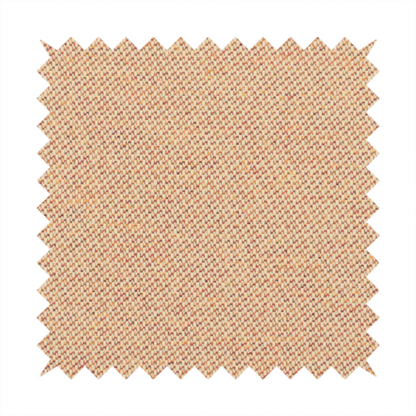 A warm terracotta and peach textile featuring a dense diagonal twill weave. The fabric is a multi-tonal blend of soft orange, muted red, and cream threads, creating a heathered, sun-baked appearance.