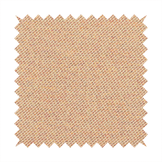 A warm terracotta and peach textile featuring a dense diagonal twill weave. The fabric is a multi-tonal blend of soft orange, muted red, and cream threads, creating a heathered, sun-baked appearance.