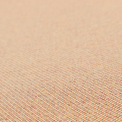 A warm terracotta and peach textile featuring a dense diagonal twill weave. The fabric is a multi-tonal blend of soft orange, muted red, and cream threads, creating a heathered, sun-baked appearance.