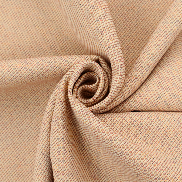 A warm terracotta and peach textile featuring a dense diagonal twill weave. The fabric is a multi-tonal blend of soft orange, muted red, and cream threads, creating a heathered, sun-baked appearance.