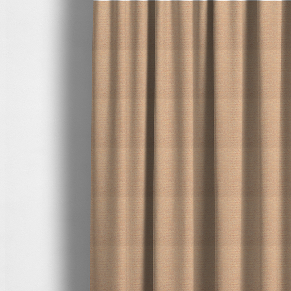 The fabric used to create these made-to-measure curtains is a warm terracotta and peach textile featuring a dense diagonal twill weave. The fabric is a multi-tonal blend of soft orange, muted red, and cream threads, creating a heathered, sun-baked appearance.