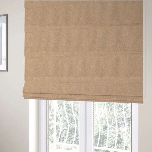 The fabric used to create these Roman blinds is a warm terracotta and peach textile featuring a dense diagonal twill weave. The fabric is a multi-tonal blend of soft orange, muted red, and cream threads, creating a heathered, sun-baked appearance.