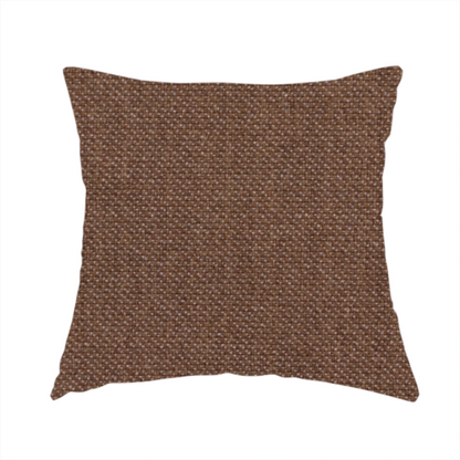 The fabric used to create this handmade cushion is a dark chocolate or mocha brown textile with a tight diagonal twill weave. The fabric is woven with a deep brown base interspersed with fine, lighter threads that create a subtle shimmering or "salt and pepper" effect across the surface.