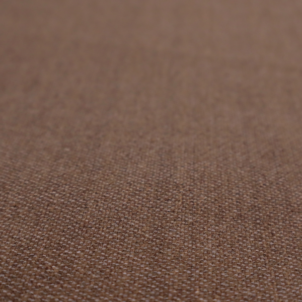a dark chocolate or mocha brown textile with a tight diagonal twill weave. The fabric is woven with a deep brown base interspersed with fine, lighter threads that create a subtle shimmering or "salt and pepper" effect across the surface.