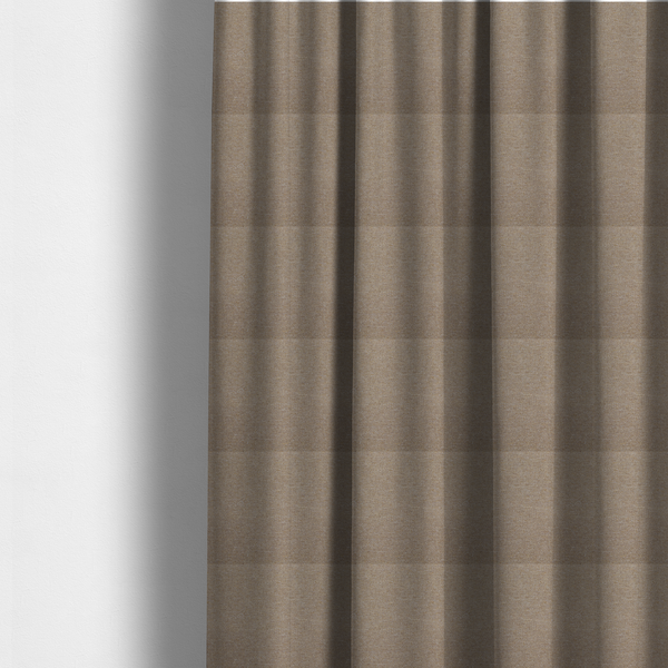 The fabric used to create these made-to-measure curtains is a muted taupe or mushroom-coloured textile with a tight diagonal twill weave. The fabric is a multi-tonal blend, interlacing earthy brown and grey-beige yarns with fine cream and gold flecks, creating a sophisticated heathered effect.