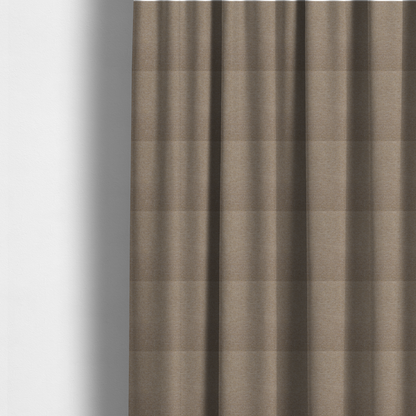 The fabric used to create these made-to-measure curtains is a muted taupe or mushroom-coloured textile with a tight diagonal twill weave. The fabric is a multi-tonal blend, interlacing earthy brown and grey-beige yarns with fine cream and gold flecks, creating a sophisticated heathered effect.