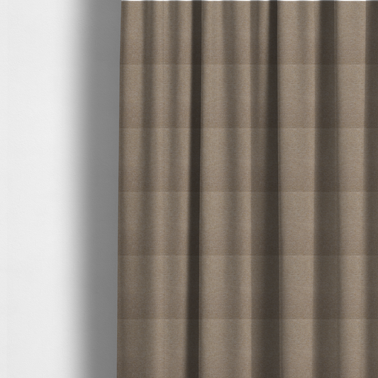 The fabric used to create these made-to-measure curtains is a muted taupe or mushroom-coloured textile with a tight diagonal twill weave. The fabric is a multi-tonal blend, interlacing earthy brown and grey-beige yarns with fine cream and gold flecks, creating a sophisticated heathered effect.