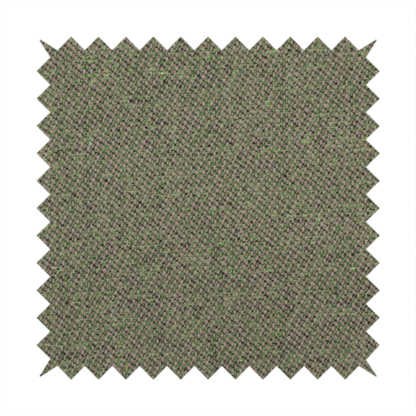 An olive or moss green textile featuring a dense diagonal twill weave. The fabric is a multi-tonal blend, interlacing earthy brownish-grey yarns with vibrant lime green flecks, creating a textured, heathered appearance.