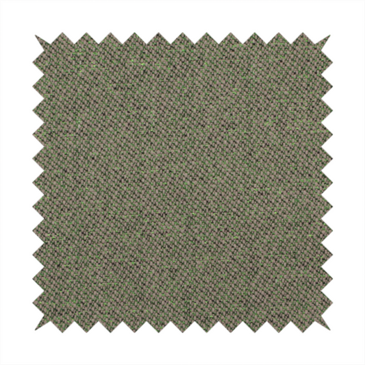 An olive or moss green textile featuring a dense diagonal twill weave. The fabric is a multi-tonal blend, interlacing earthy brownish-grey yarns with vibrant lime green flecks, creating a textured, heathered appearance.