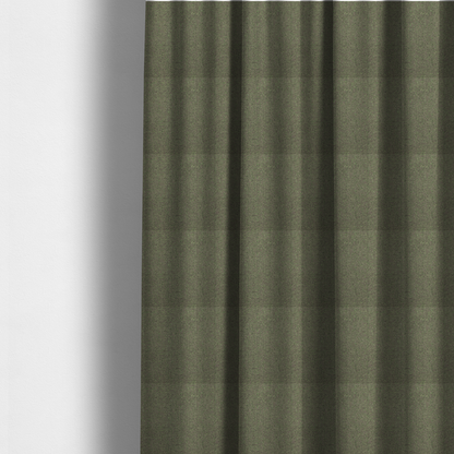 The fabric used to create these made-to-measure curtains is a olive or moss green textile featuring a dense diagonal twill weave. The fabric is a multi-tonal blend, interlacing earthy brownish-grey yarns with vibrant lime green flecks, creating a textured, heathered appearance.