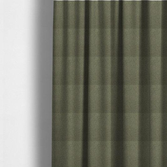 The fabric used to create these made-to-measure curtains is a olive or moss green textile featuring a dense diagonal twill weave. The fabric is a multi-tonal blend, interlacing earthy brownish-grey yarns with vibrant lime green flecks, creating a textured, heathered appearance.