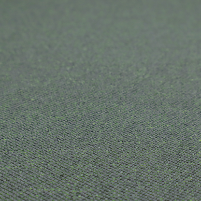 A charcoal or slate grey textile with a tight diagonal twill weave. The fabric is a multi-tonal blend, interlacing dark grey yarns with subtle, bright lime green flecks that provide a modern, heathered dimension.