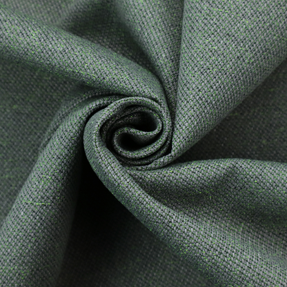 A charcoal or slate grey textile with a tight diagonal twill weave. The fabric is a multi-tonal blend, interlacing dark grey yarns with subtle, bright lime green flecks that provide a modern, heathered dimension.