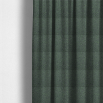 The fabric used to create these made-to-measure curtains is a charcoal or slate grey textile with a tight diagonal twill weave. The fabric is a multi-tonal blend, interlacing dark grey yarns with subtle, bright lime green flecks that provide a modern, heathered dimension.