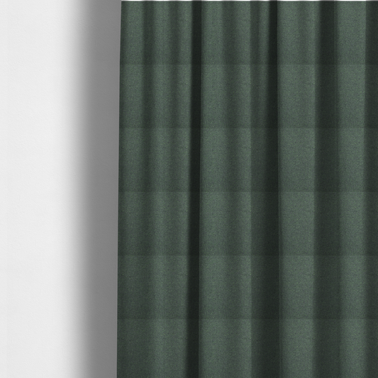 The fabric used to create these made-to-measure curtains is a charcoal or slate grey textile with a tight diagonal twill weave. The fabric is a multi-tonal blend, interlacing dark grey yarns with subtle, bright lime green flecks that provide a modern, heathered dimension.